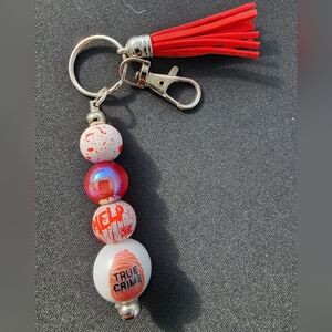 True Crime Red and White Keychain with Tassel